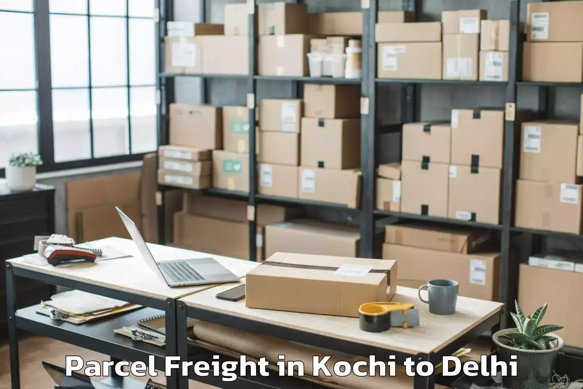 Book Kochi to Defence Colony Parcel Freight Online